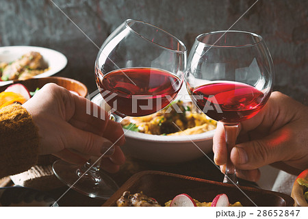 Glasses with a drink in his hand and a festive Glasses with a drink in his hand and a festive 28652847