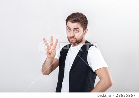 young man with a beard in white shirt and black 28655867