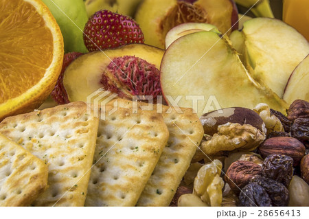 Snacks background, fruits, nuts, crackers Snacks background, fruits, nuts, crackers 28656413