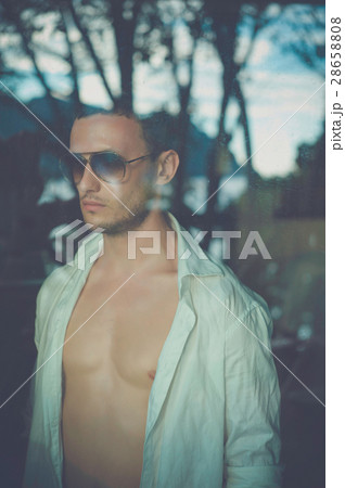 Portrait of man through the window 28658808