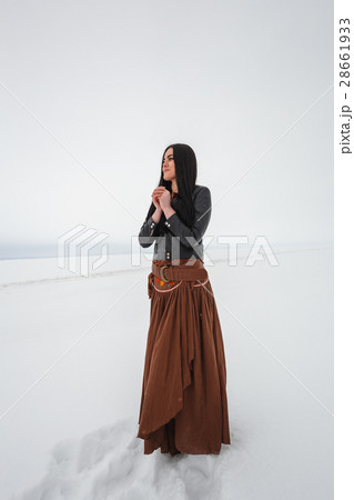 Girl in ethnic costume standing in a field, which Girl in ethnic costume standing in a field, which 28661933