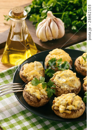 Baked mushroom caps stuffed with creams cheese. Baked mushroom caps stuffed with creams cheese. 28662103