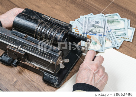 Old adding machine with money Old adding machine with money 28662496