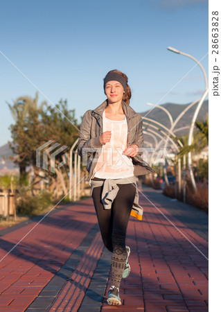 Young woman jogging  28663828