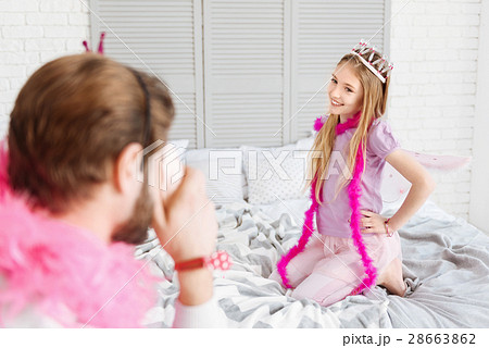 Kind smiling girl holding her hands on the waist Kind smiling girl holding her hands on the waist 28663862