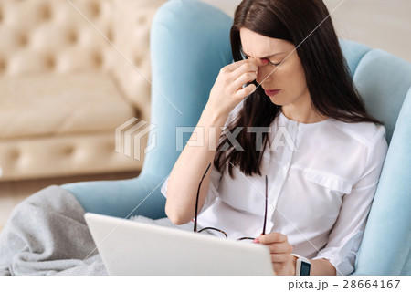 Unhappy tired woman having a headache 28664167