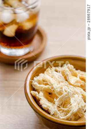close up in dried squid and cola in glass close up in dried squid and cola in glass 28667917