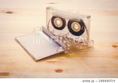 Burred cassette tape over wooden background Burred cassette tape over wooden background 28668054