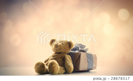 cute teddy bear and beautiful gift on the fairy lights bokeh bac 28678317