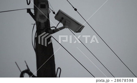 surveillance camera on a lamp post on blue sky surveillance camera on a lamp post on blue sky 28678598