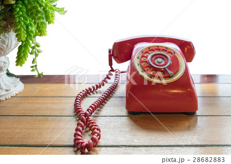 Red telephone vintage old style on table Red telephone vintage old style on table 28682883