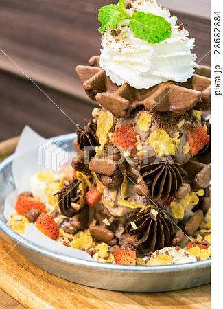 Waffle chocolate ice cream with topping fruits Waffle chocolate ice cream with topping fruits 28682884
