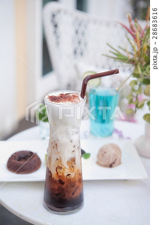 delicious iced coffee with foam  on the table 28683616