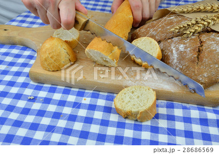 Cutting White and Dark Bread 28686569