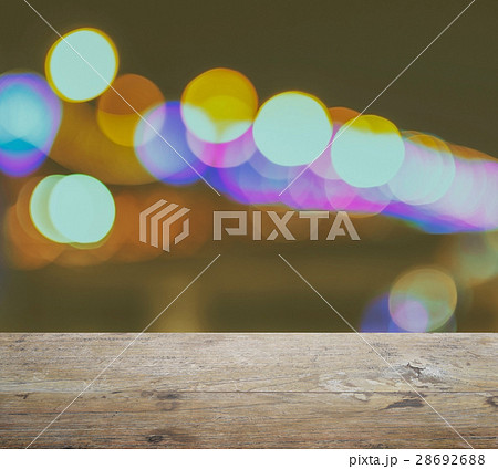 wood table top on background with bokeh lights 28692688