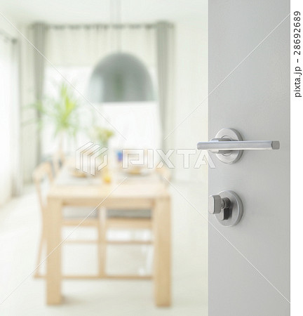 opened door to dining table and comfortable chairs 28692689