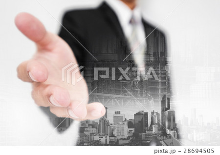 Businessman stretch out hand, with double exposure 28694505