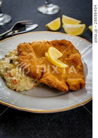 Schnitzel with salad 28696404
