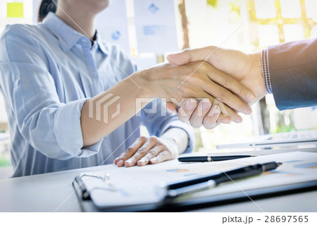 Businessmen shaking hands during a meeting 28697565