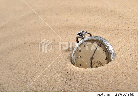 Antique pocket watch in sand 28697869