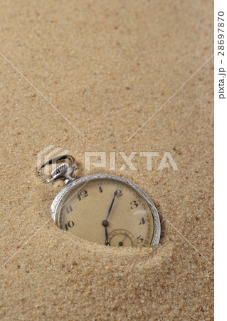 Antique pocket watch in sand 28697870