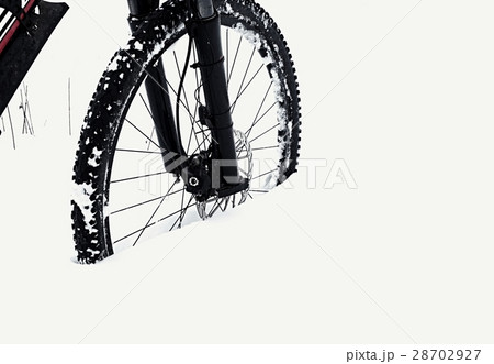 Bike in powder snow. Lost in deep snowdrift. 28702927