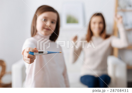 Positive girl holding thermometer 28708431