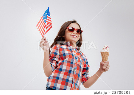 Sanguine little girl celebrating American national Sanguine little girl celebrating American national 28709202