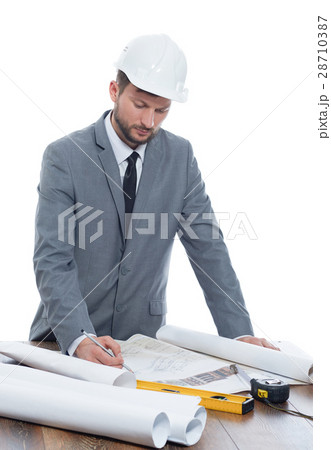 Handsome mature contractor drawing a building plan 28710387