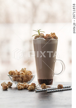 Glass of coffee with popcorn Glass of coffee with popcorn 28711858