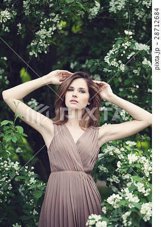 Spring Portrait of Fashion Model Woman in a Park Spring Portrait of Fashion Model Woman in a Park 28712684