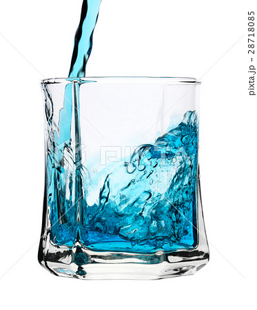Cool blue drink is being poured into glass 28718085