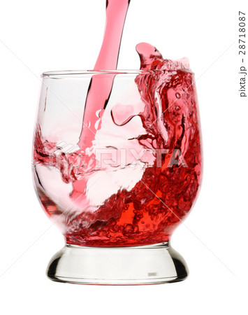 Red wine is being poured into glass, small splash Red wine is being poured into glass, small splash 28718087