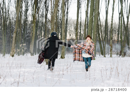 young couple dancing in winter forest young couple dancing in winter forest 28718400