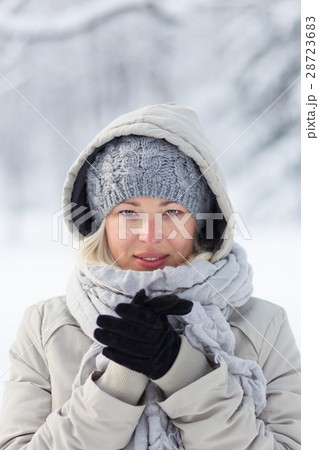 Portrait of lady outdoor in snow in cold winter 28723683