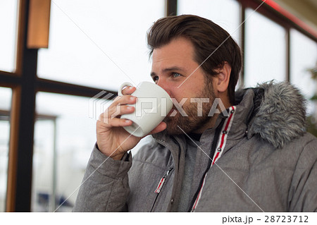 Thoughtful man wearing warm winter jacket looking 28723712