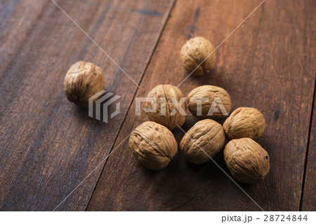 Walnuts shell on wooden table 28724844