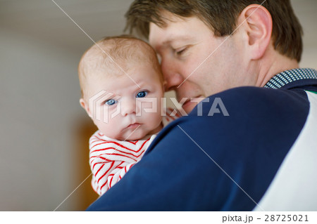 Happy proud young father with newborn baby Happy proud young father with newborn baby 28725021