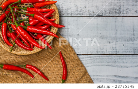 Hot and spicy red chilli on wood table background 28725348