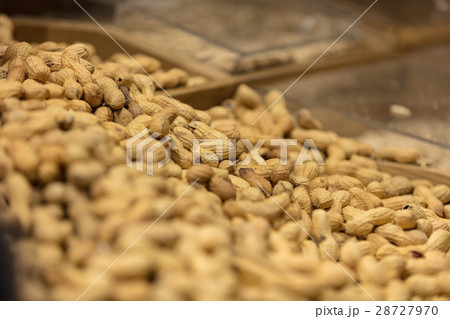 A bunch of Peanut shells in grocery store. 28727970