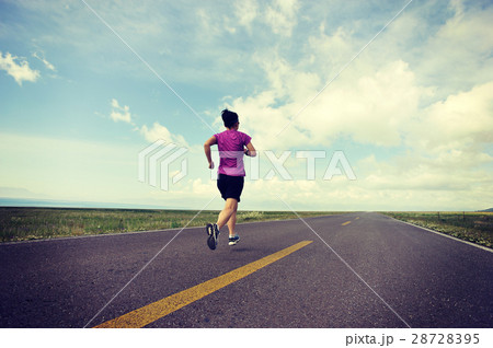 young fitness woman trail runner running on road young fitness woman trail runner running on road 28728395