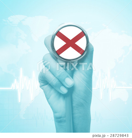 doctor holding stethoscope with Alabama flag. doctor holding stethoscope with Alabama flag. 28729843