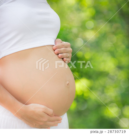 Beautiful belly of young pregnant woman Beautiful belly of young pregnant woman 28730719
