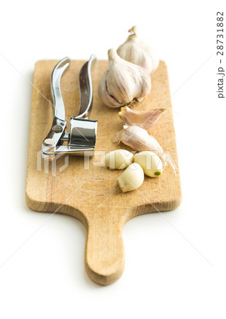 Garlic and garlic press. 28731882