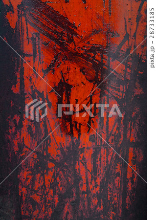 Red paint peeling off a metal plate, background. 28733185