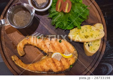 Grilled salmon steak with the fresh salad Grilled salmon steak with the fresh salad 28733198
