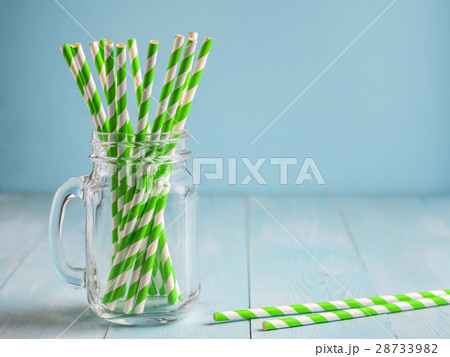 Mason jars with yellow paper straws and cap. Ideal Mason jars with yellow paper straws and cap. Ideal 28733982