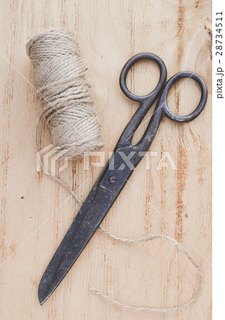 Old scissors and skein jute twine. Old scissors and skein jute twine. 28734511