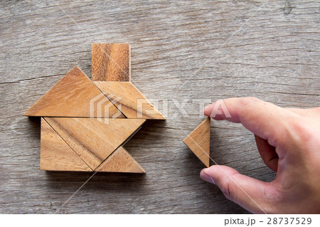 Wooden tangram puzzle wait to fulfill home shape Wooden tangram puzzle wait to fulfill home shape 28737529