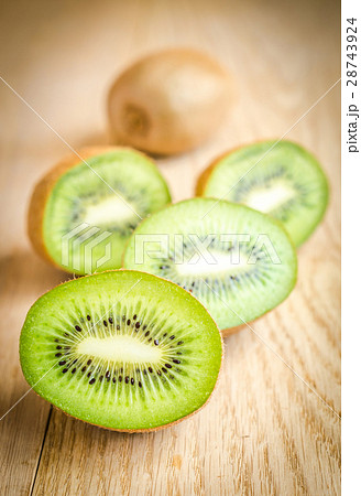Kiwi on the wooden background 28743924